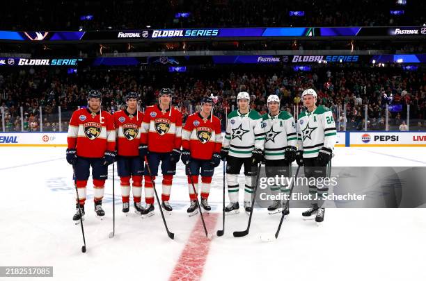 Finnish players Aleksander Barkov, Eetu Luostarinen, Niko Mikkola, and Anton Lundell of the Florida Panthers pose with Esa Lindell, Miro Heiskanen,...