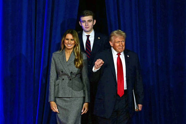 Former US President and Republican presidential candidate Donald Trump arrives for an election night event alongside former US First Lady Melania...