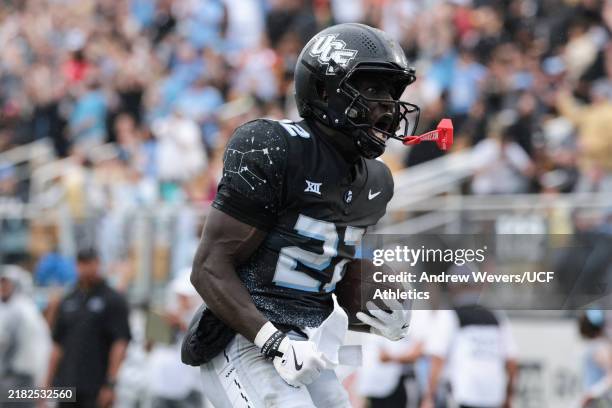 Myles Montgomery of the UCF Knights reacts after scoring a touchdown during the second quarter against the Arizona Wildcats at FBC Mortgage Stadium...