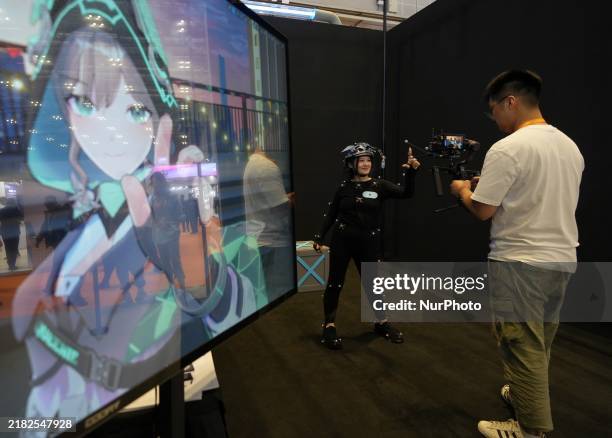 Staff member demonstrates full-body motion capture technology at the 7th CIIE in Shanghai, China, on November 6, 2024.