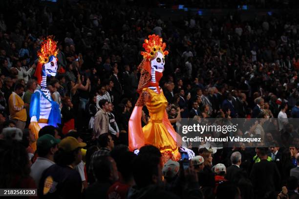 The 'Catrinas' as part of the 'Day of the Dead' perform before the game between Miami Heat and the Washington Wizards at Arena Ciudad de Mexico on...