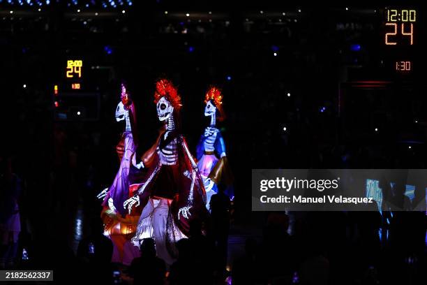 The 'Catrinas' as part of the 'Day of the Dead' perform before the game between Miami Heat and the Washington Wizards at Arena Ciudad de Mexico on...