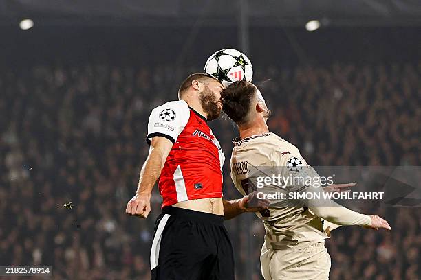Feyenoord's Dutch defender Bart Nieuwkoop and Salzburg's Serbian defender Aleksa Terzic jump to head the ball during the UEFA Champions League,...