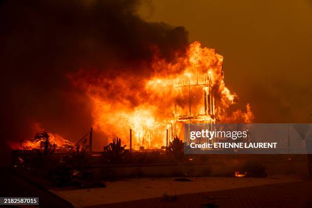 House is engulfed in the flames of the Mountain Fire as the wildfire scorches acres in Camarillo Heights, Camarillo, California, on November 6, 2024....