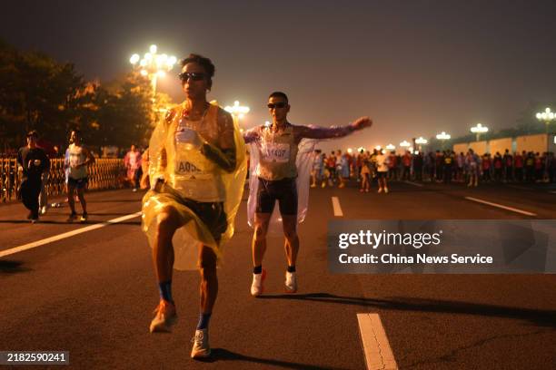 Runners warm up before the 2024 Beijing Marathon on November 3, 2024 in Beijing, China.