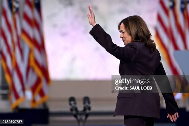 Vice President Democratic presidential candidate Kamala Harris waves at supporters as she walks off stage after speaking at Howard University in...