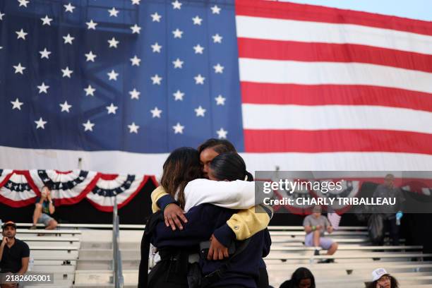 Supporters embrace following US Vice President Democratic presidential candidate Kamala Harris speech at Howard University in Washington, DC, on...