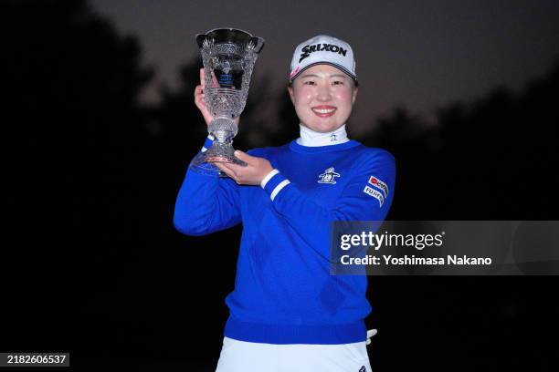 Rio Takeda of Japan poses with the trophy after winning the tournament following the final round of the TOTO Japan Classic 2024 at Seta Golf Course...