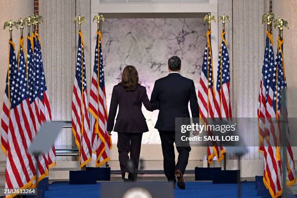 Vice President Democratic presidential candidate Kamala Harris and her husband Second Gentleman Doug Emhoff leave after she delivered her concession...