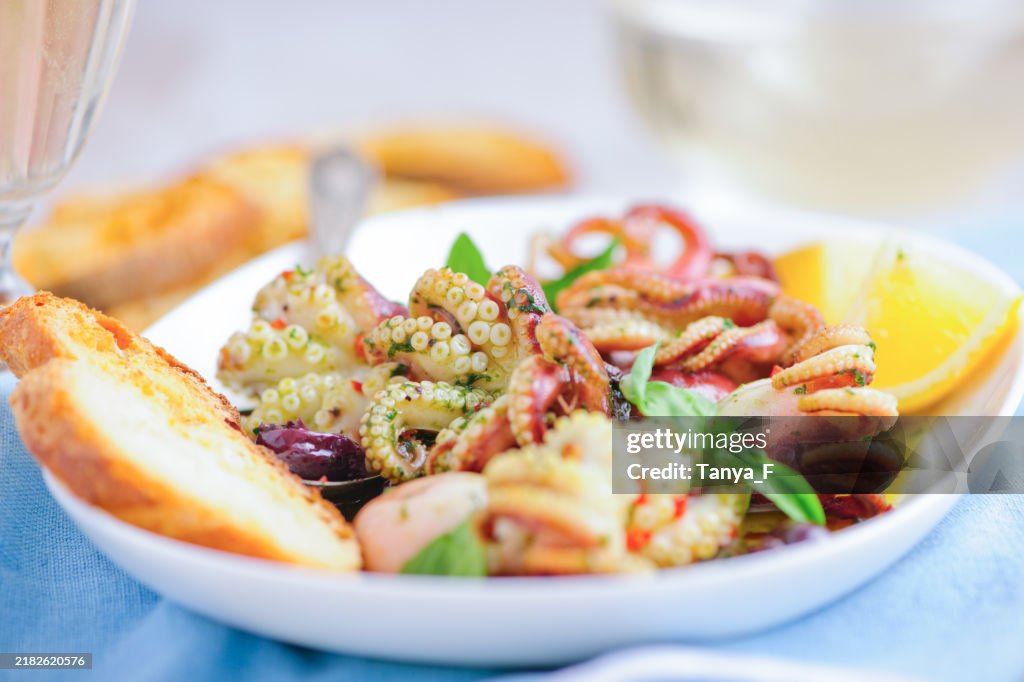 Gourmet Octopus Salad with Olives, Fresh Basil and Olive Oil Dressing
