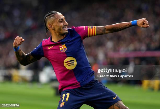 Raphinha of FC Barcelona celebrates scoring his team's second goal during the La Liga EA Sports match between FC Barcelona and RCD Espanyol at Estadi...