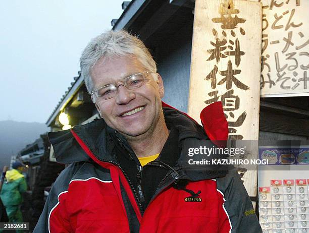 Hartwig Gauder, former German Olympic champion, smiles as he celebrates after reaching the summit of Mt. Fuji 776-metre , 19 July 2003. Gauder is on...