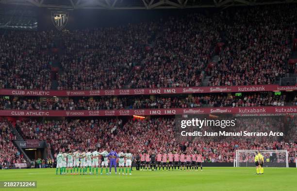 Players, match officials and fans take part in a minute's silence for the victims of the Flooding Disaster in Spain prior to the LaLiga match between...