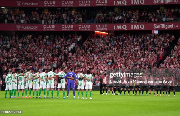 Players, match officials and fans take part in a minute's silence for the victims of the Flooding Disaster in Spain prior to the LaLiga match between...
