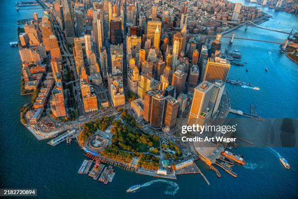 high above lower manhattan - brooklyn bridge aerial stock pictures, royalty-free photos & images