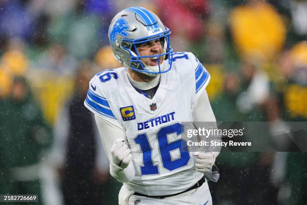 Quarterback Jared Goff of the Detroit Lions reacts after throwing a second quarter touchdown pass against the Green Bay Packers at Lambeau Field on...