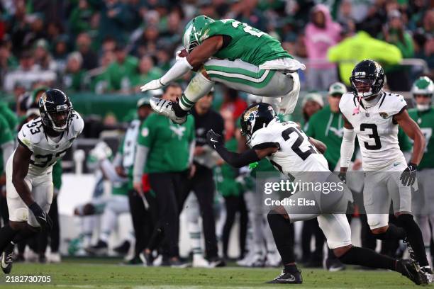 Saquon Barkley of the Philadelphia Eagles hurdles Jarrian Jones of the Jacksonville Jaguars in the second quarter of a game at Lincoln Financial...
