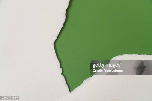 torn paper frame,green against white background,copy space - white construction paper texture stock pictures, royalty-free photos & images