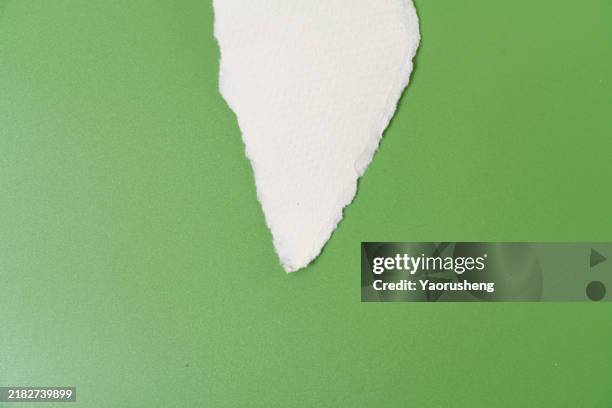 torn paper frame,green against white background,copy space - white construction paper texture stock pictures, royalty-free photos & images