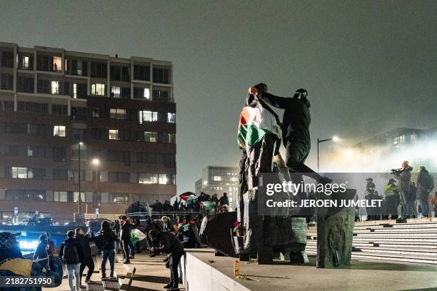 Pro-Palestinians demonstrate at Amsterdam's Anton de Komplein square ahead of the UEFA Europa League football match between Ajax and Maccabi Tel Aviv...