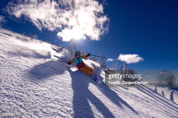 powder skiing - skier stock pictures, royalty-free photos & images