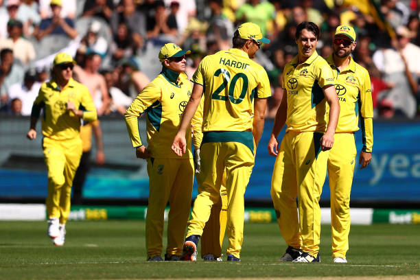 Pat Cummins of Australia celebrates the wicket of Kamran Ghulam of Pakistan during game one of the Men's One Day International series between...