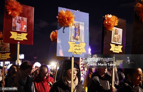 Arizona for Abortion Access supporters carry photographs of women who died because of abortion bans in Georgia and Texas during the 35th annual All...