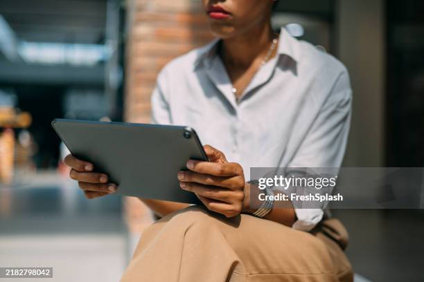 modern woman using digital tablet indoors for work or study - using screen reader stock pictures, royalty-free photos & images