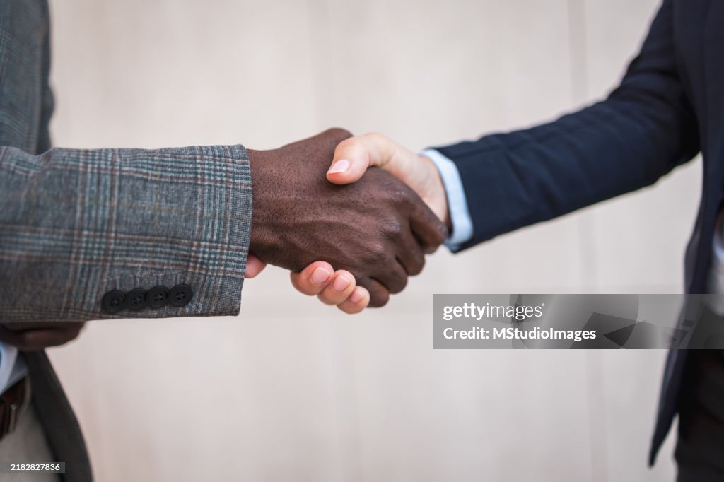 Close-up of a handshake between two business professionals