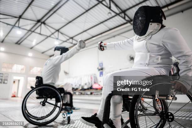 people practicing fencing at a health club - foil sword stock pictures, royalty-free photos & images