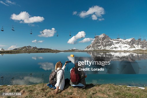 Beautiful blonde woman and her husband during an alpine lake bathing meditation trip Beautiful blonde woman and her husband during an alpine lake bathing meditation trip