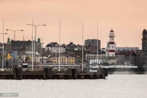 malmö harbor, lighthouse, skane-county, malmö, sweden, scandinavia, europe - malmo stock pictures, royalty-free photos & images