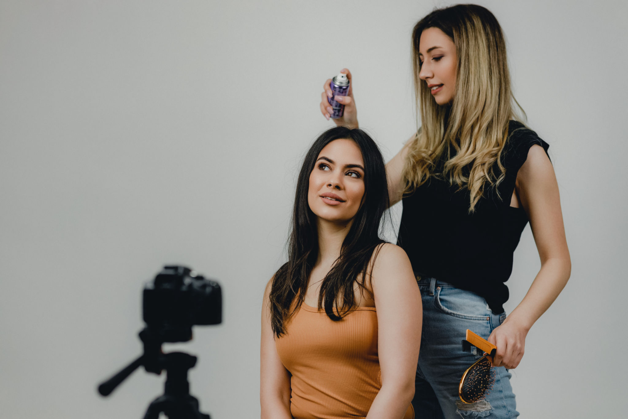 Professional Hairdresser Styling Models' Hair for the Photoshoot Professional Hairdresser Styling Models' Hair for the Photoshoot