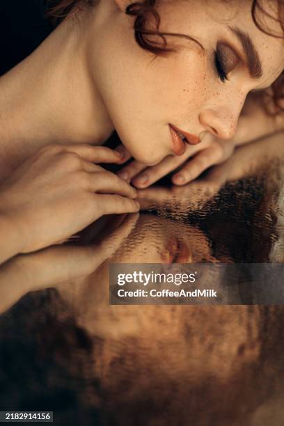 whispers in the reflection - water reflection face stock pictures, royalty-free photos & images