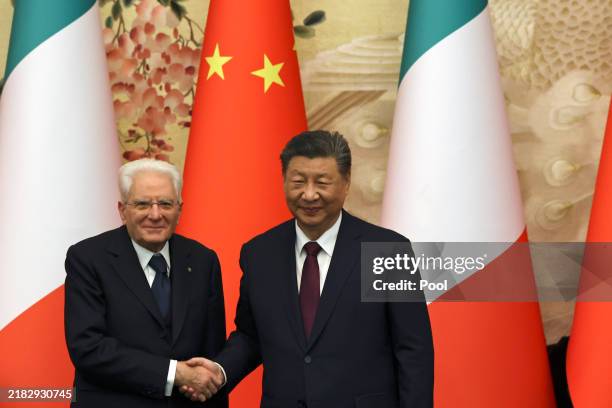 Chinese President Xi Jinping and Italian President Sergio Mattarella shake hands at a signing ceremony at The Great Hall Of The People on November 8,...