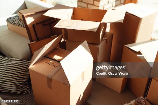 preparing for moving home or office - stacking boxes stock pictures, royalty-free photos & images