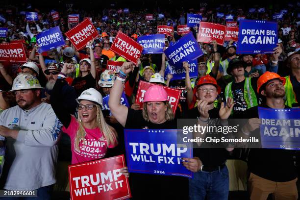 Supporters cheer as Republican presidential nominee, former President Donald Trump holds a campaign rally at the PPG Paints Arena on November 04,...