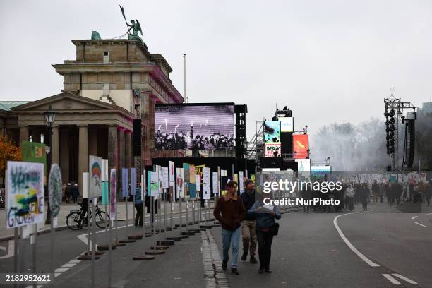 View of the exhibition and the Brandenburg Gate, a day before 35th Berlin Wall fall anniversary, in Berlin, Germany on November 8, 2024.