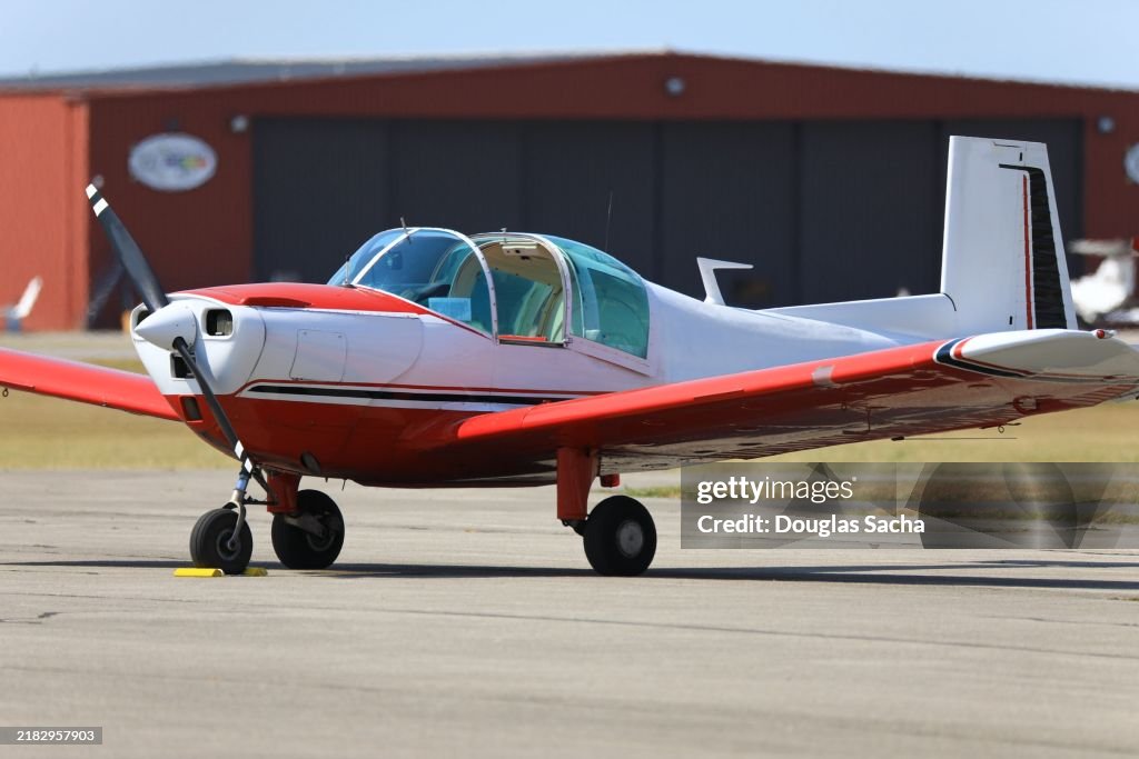 Small airplane parked on the tarmac