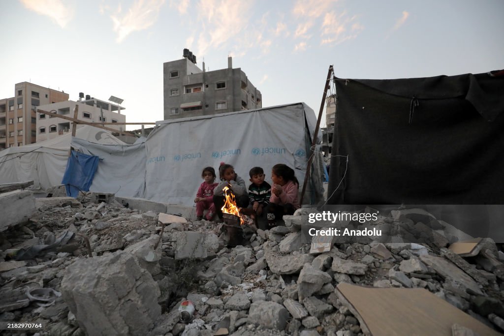 Palestinians endure harsh conditions in Gaza's Bureij Refugee Camp amidst cold and Israeli attacks