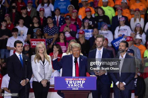 Republican presidential nominee, former U.S. President Donald Trump, speaks at a rally with his family members during the early-morning hours of...