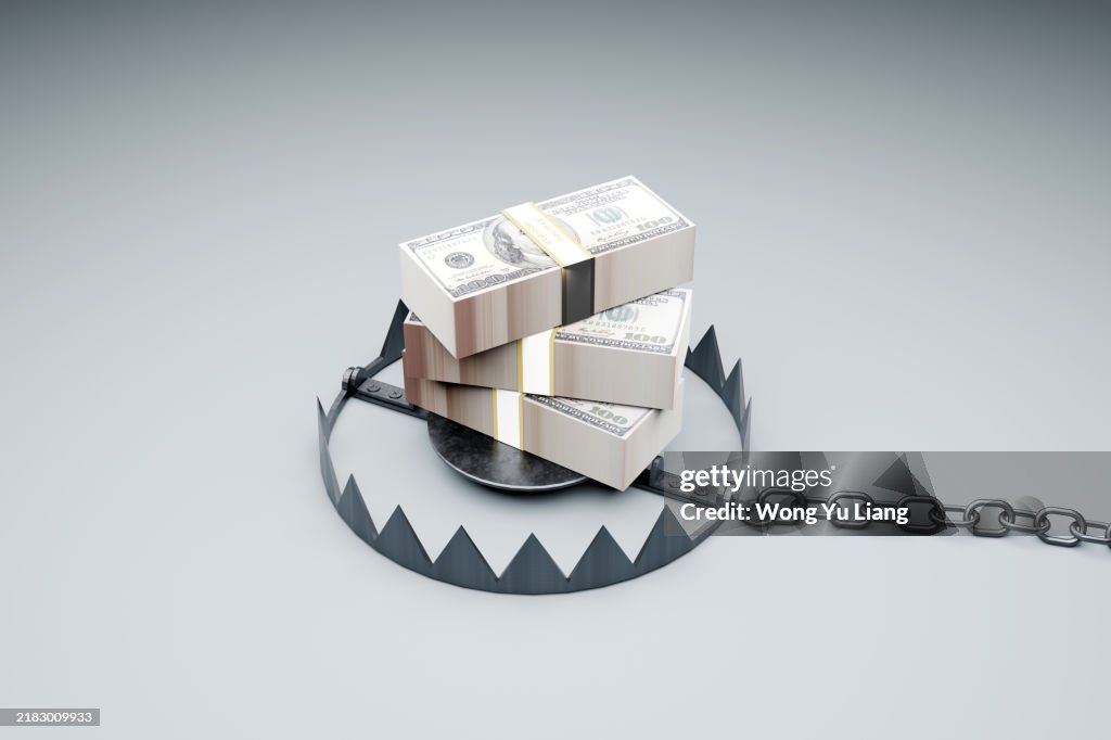 Stack of American dollars and Bear Trap . Financial Trap concept