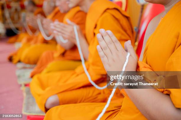 monks chanting the ritual of wedding ceremony and use candles to chant the holy. - swayambhunath stock pictures, royalty-free photos & images
