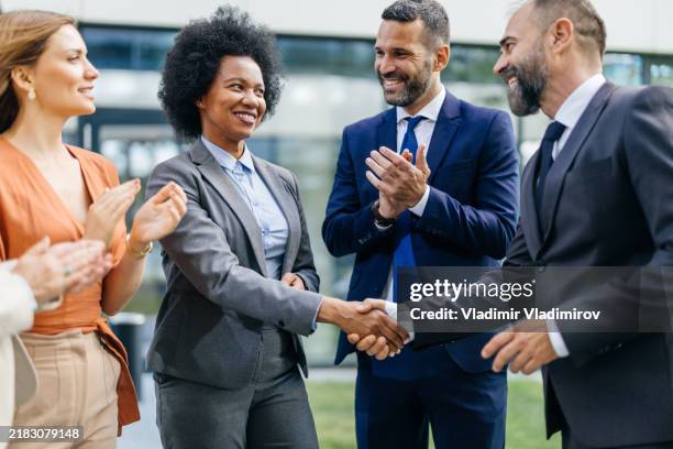 Front Handshake 516 Handshake In Front Of Building Stock Photos, High-Res Pictures, and ...