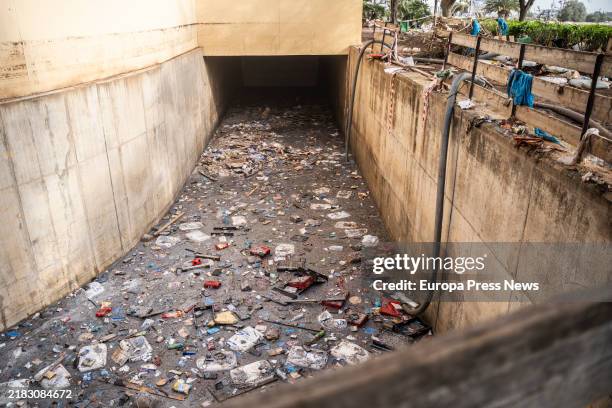 Trash and mud accumulated in the parking lot of the Bonaire shopping center on November 5 in Valencia, Valencian Community, Spain. Today marks one...