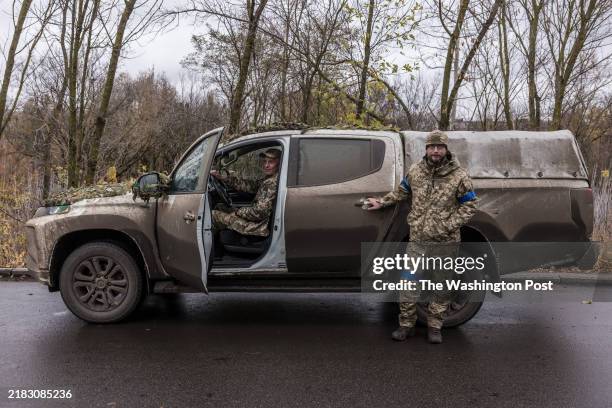 Andriy Vavilov left, and Valentyn Levada soldiers in the strike UAVs company of the 82nd Air Assault Brigade, pose for a portrait with their military...