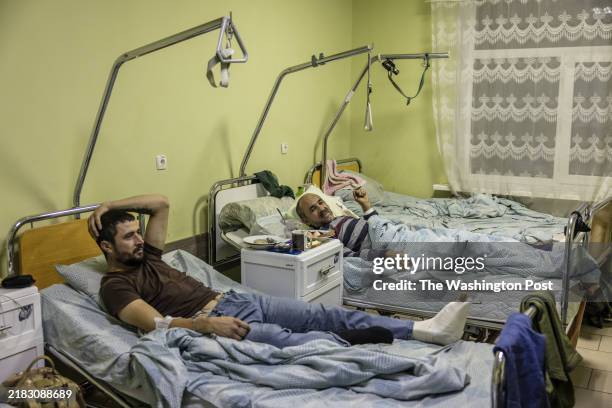 Viktor left, and Maksym soldiers who just came out of fighting in the Kursk direction, rest on their hospital beds in one of the hospitals in Sumy...