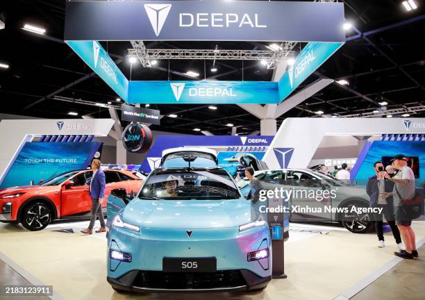 Audience visit the exhibition stand for Deepal during the Sydney International EV AutoShow 2024 in Sydney, Australia, Nov. 8, 2024. The three-day...