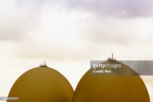 two gas storage tanks - petrol tank stock pictures, royalty-free photos & images