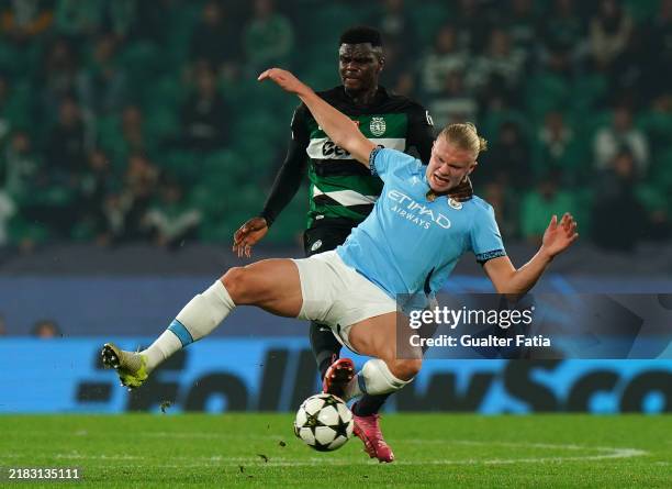 Erling Haaland of Manchester City is tackled by Ousmane Diomande of Sporting CP during the UEFA Champions League 2024/25 League Phase MD4 match...